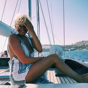 White and blue linen jumpsuit with side slits